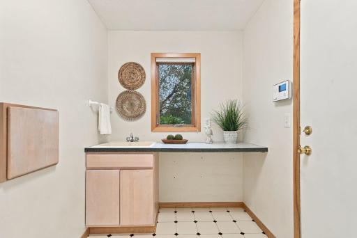 A practical main-level service area adds valuable storage and workspace.