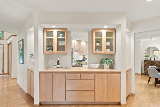 Thoughtful built-in cabinetry adds warmth and function between the main living spaces.