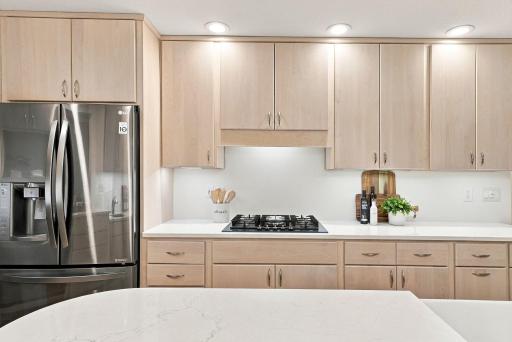 The renovated kitchen combines generous workspace with clean, timeless finishes.