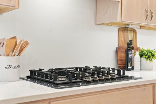 The cooktop is integrated into a clean, thoughtfully designed workspace.
