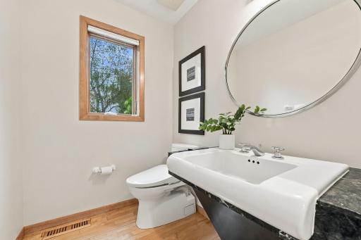 A stylish powder bath serves the main level with understated character.