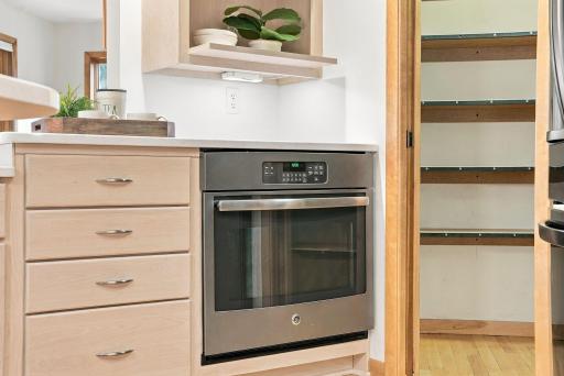 Built-in appliances contribute to the kitchen’s streamlined, tailored look.