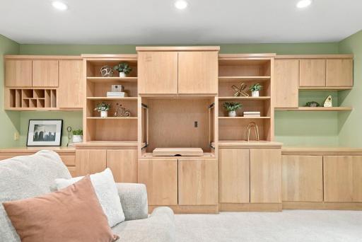 Custom cabinetry offers abundant storage while keeping the room warm and inviting.