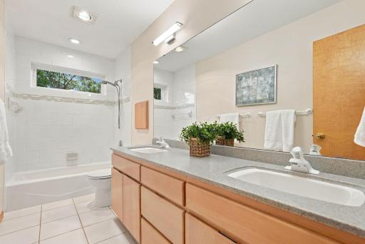 A tiled tub and shower combination serves secondary bedrooms with ease.