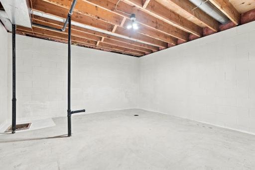 Open lower-level space provides a blank canvas for future finishing.