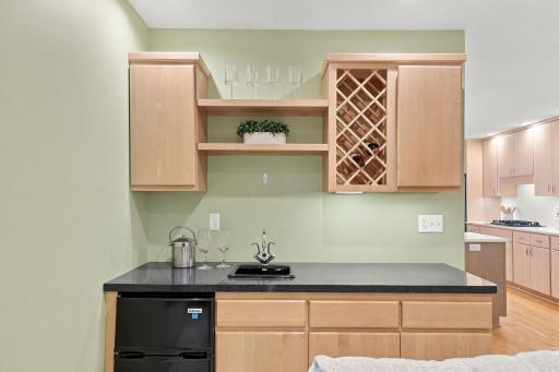A convenient wet bar adds another layer of function for entertaining.