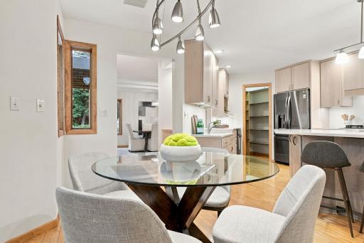 The kitchen and informal dining area come together in one bright, highly functional space.