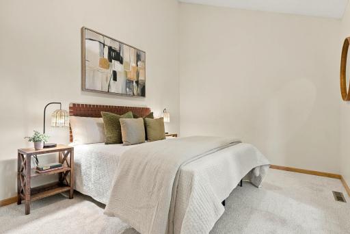 Vaulted ceilings give this secondary bedroom an unexpected sense of volume.