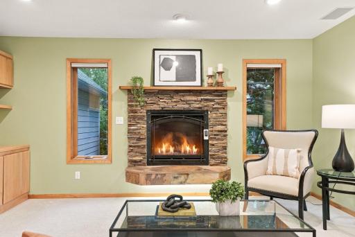 A stone fireplace anchors the family room and adds warmth to the main level.