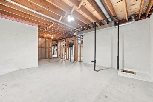 Framed areas and roughed-in plumbing within the lower level provide a head start for future plans.