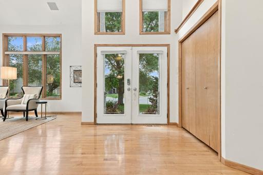 Floor-to-ceiling windows create a beautiful connection between the main living spaces and outdoors.