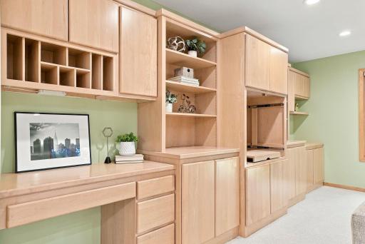 Extensive built-ins create flexible space for a home office, media room, or additional living area.
