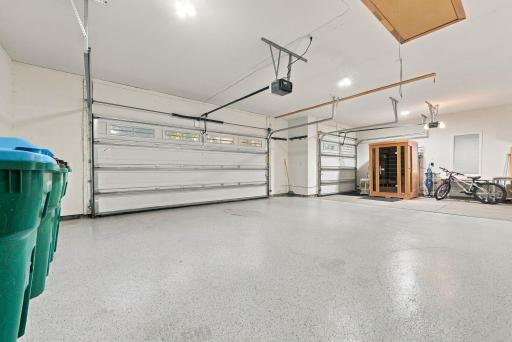 The garage is fully heated with epoxy floors and a private staircase to the lower-level of the home.