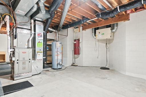 Mechanical systems are easily accessible within the unfinished lower level.