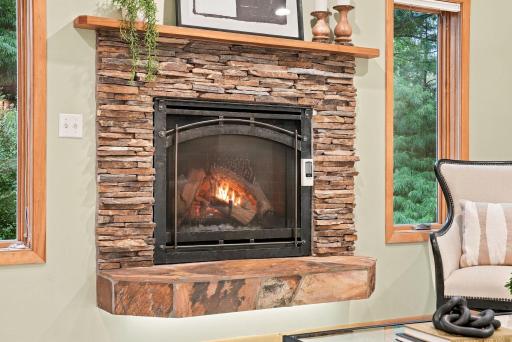 Natural stone gives the family room fireplace texture and character.