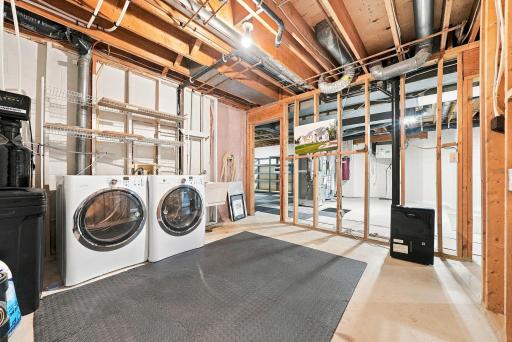 A dedicated utility and laundry area keeps household functions organized downstairs.