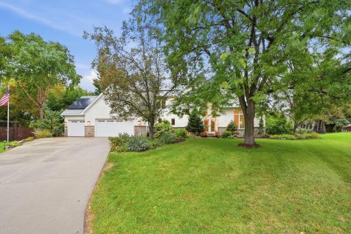 Thoughtful landscaping frames the home and highlights its distinctive architecture.
