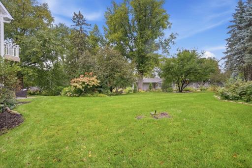 Mature trees and established plantings give the property a peaceful, natural feel.