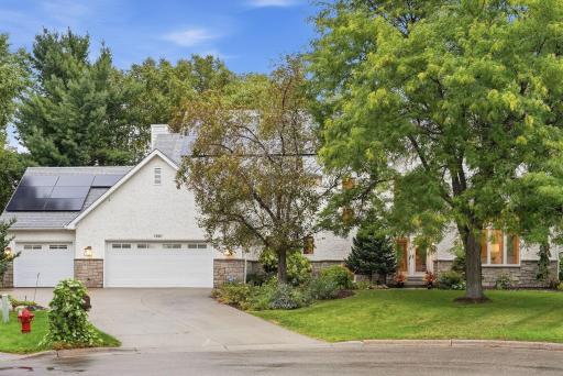 Mature landscaping gives the property a distinctive sense of place from the street.