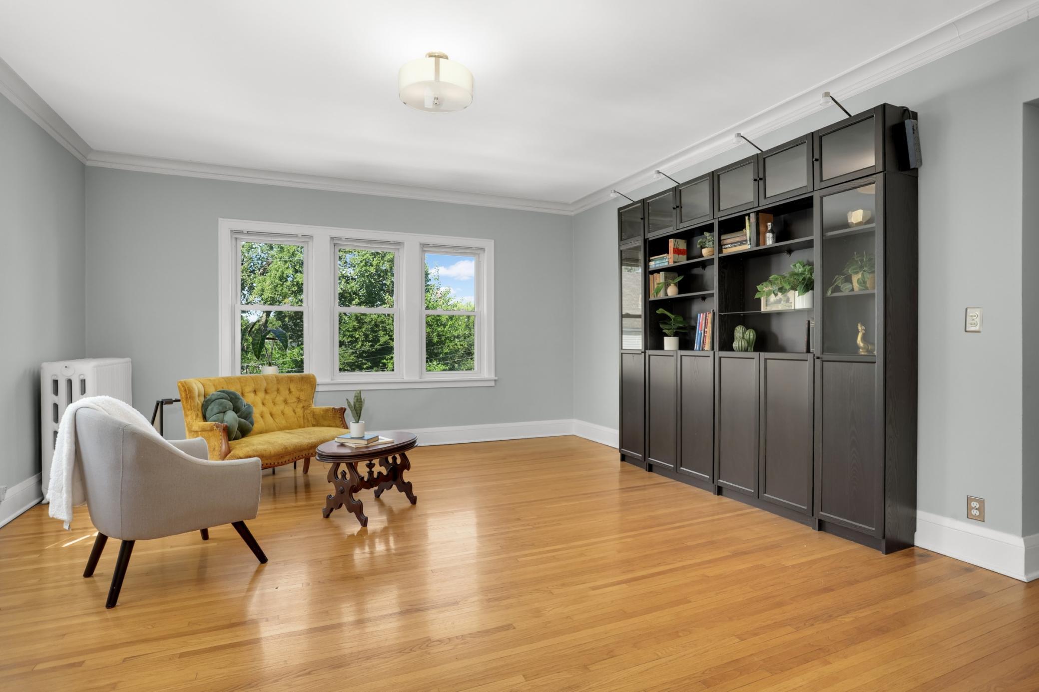 Hardwood floors abound, rooms are spacious and bright.