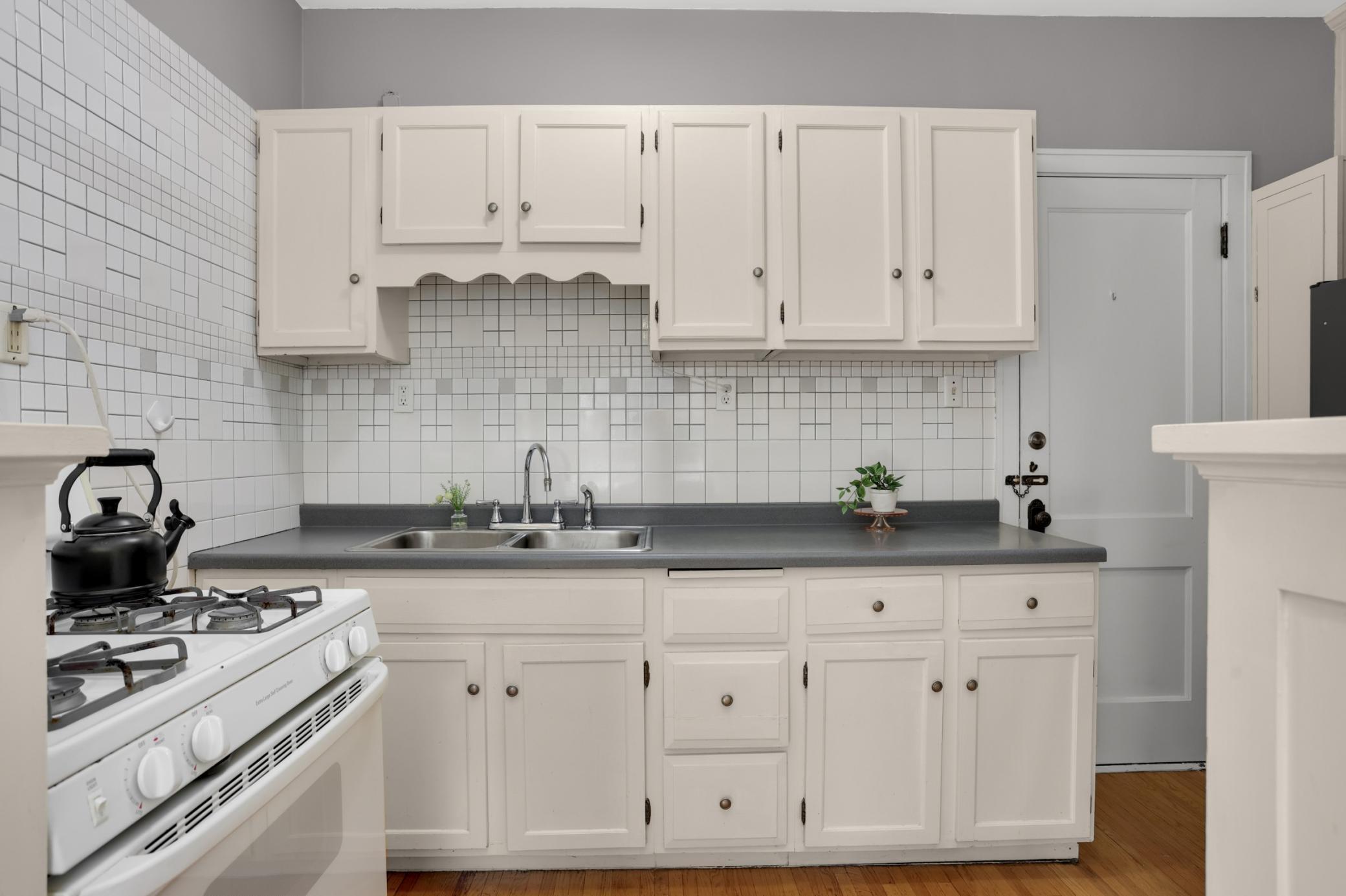 The kitchen boasts nice cabinetry and solid workspace.