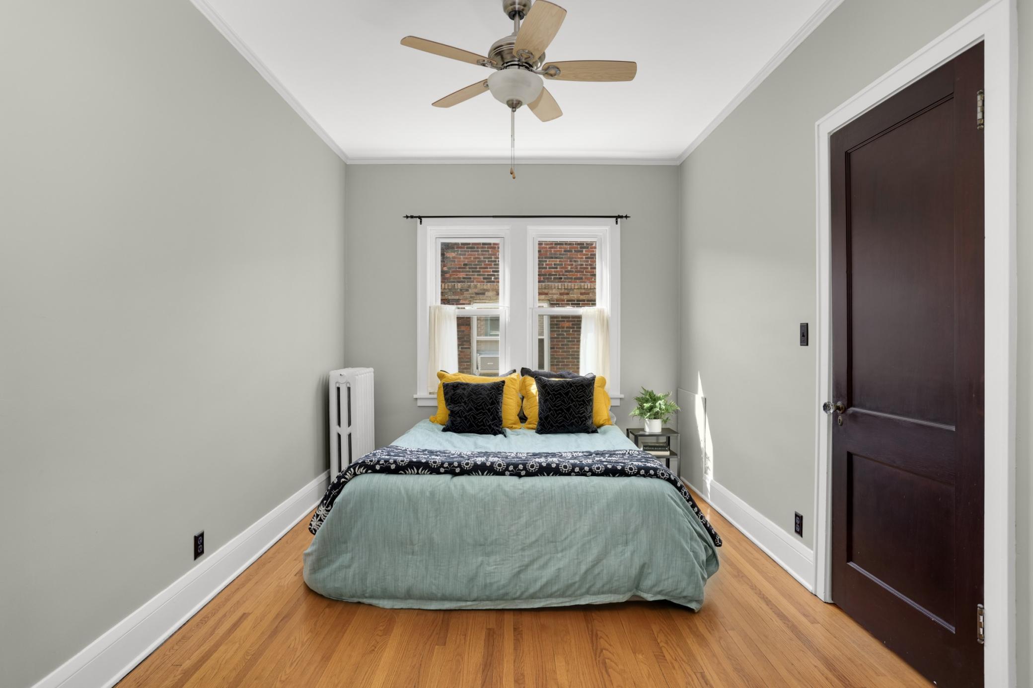 The bedroom is roomy and bright.