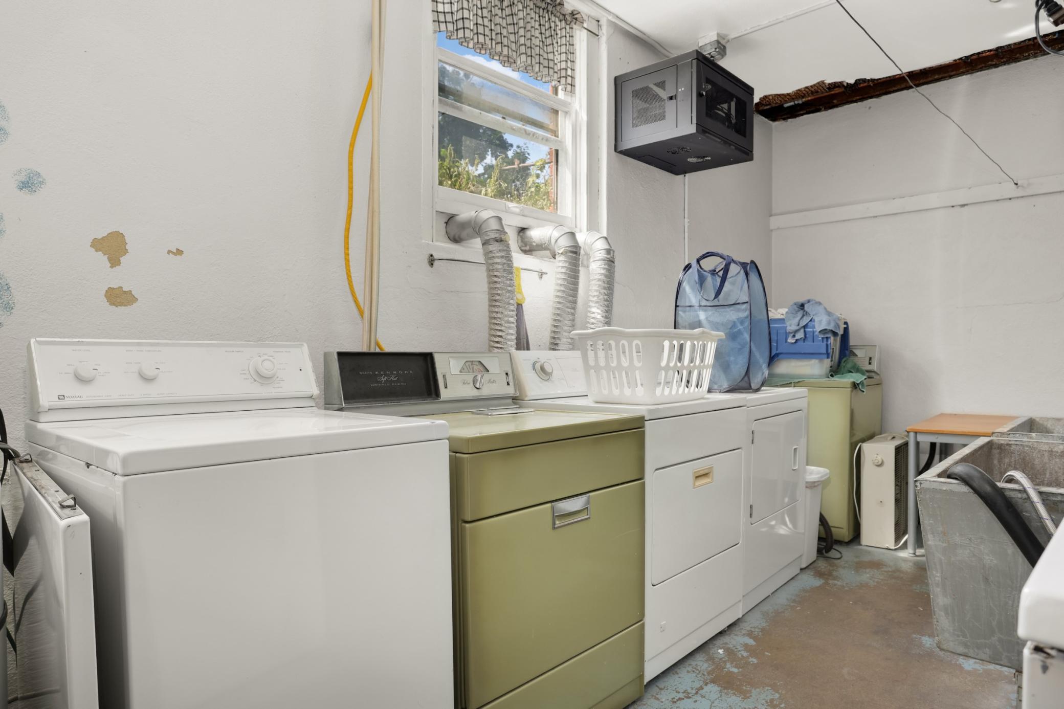 The shared laundry room is in the basement.