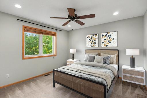 Private primary suite with fresh carpet and a walk-in closet. (virtually staged).jpg