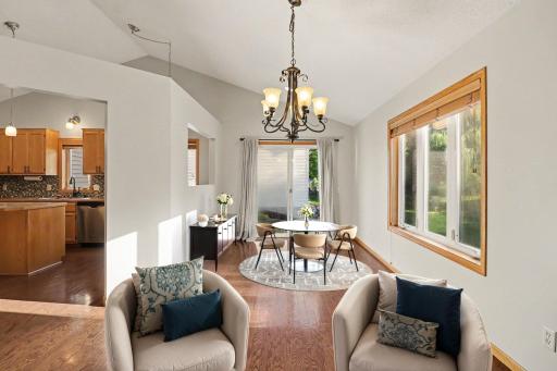Dining area with gas fireplace (virtually staged to show potential).jpg