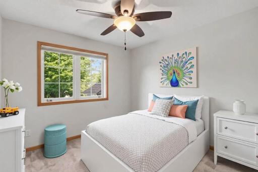 Upper-level bedroom with fresh carpet and closet storage. (virtually staged to show potential).jpg