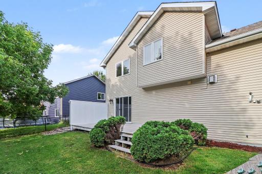 Maintenance free deck overlooking the fully fenced backyard.