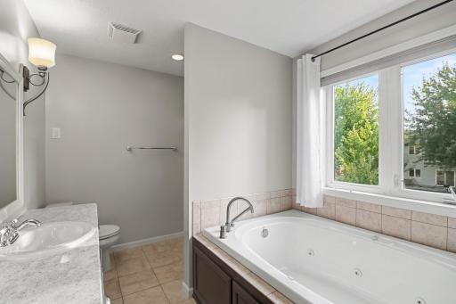 Primary bath with jetted tub and separate shower.