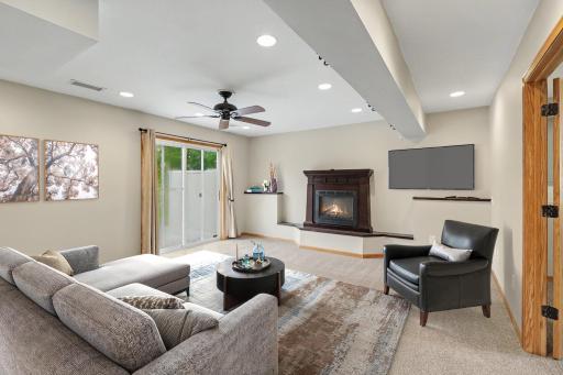 Walkout family room with a second fireplace and direct backyard access. (virtually staged to show potential layout).jpg