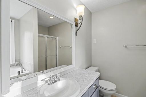 Additional view of the primary bath with jetted tub and separate shower.