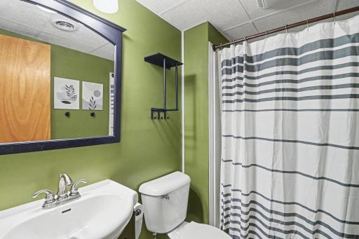 Upper-level full bath with vanity and tub-shower combination.