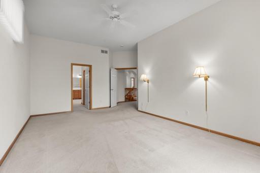 The spacious main-level primary suite is a true retreat, featuring a private bathroom with a relaxing jetted tub and direct access to the expansive outdoor deckâperfect for unwinding at the end of the day.