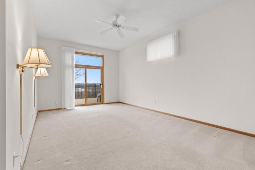 The spacious main-level primary suite is a true retreat, featuring a private bathroom with a relaxing jetted tub and direct access to the expansive outdoor deckâperfect for unwinding at the end of the day.