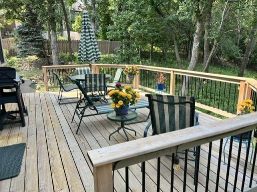 The deck has stairs leading both to the back and side yards.