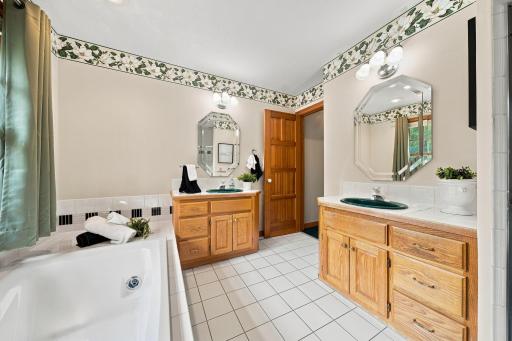 Primary bath with double vanity and sinks.