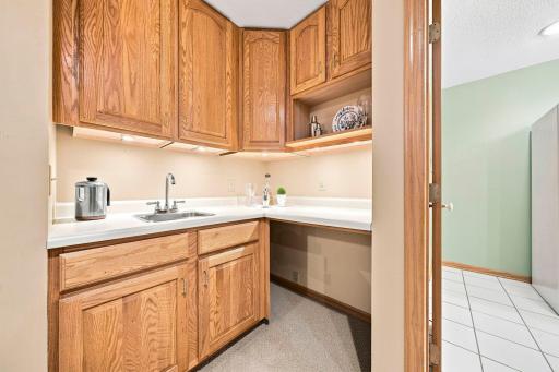 Lower level kitchenette has room for a microwave and fridge.