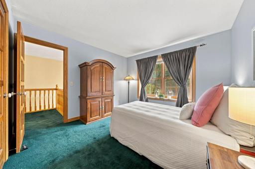 Second bedroom on upper floor with walk-in closet and connected to third bedroom by Jack and Jill bath