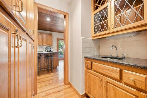 Spectacular butler pantry between the kitchen and dining room. Loaded with storage.