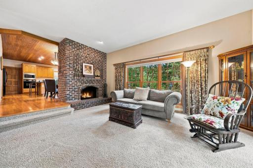 Double sided fireplace between the family room and kitchen.e