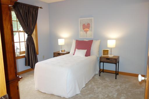 2nd bedroom on upper floor with large walk-in closet that is connected to the third upper level bedroom via a Jack and Jill bath with extra vanity.