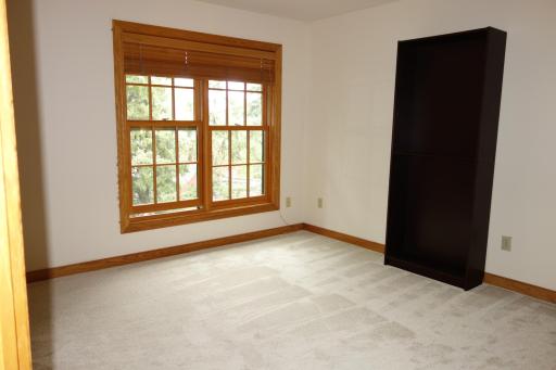 3rd bedroom on upper level has new Marvin windows and a grand walk-in closet with loads of storage.