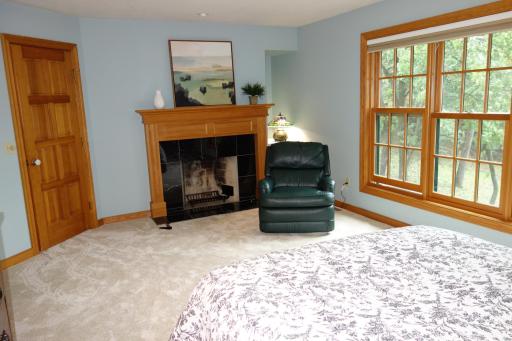 Primary Suite is complete with wood burning fireplace and beautiful Marvin Windows.