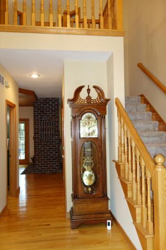 A grand foyer greets you upon entering this lovely home with hardwood stairs and new carpet.
