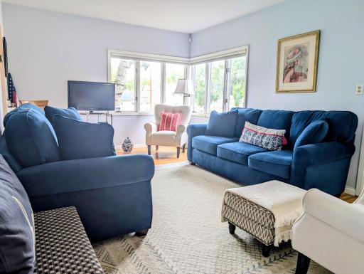 Living room with hardwood floors and large windows
