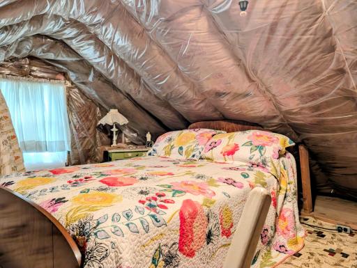 Left side of the top of the attic space
