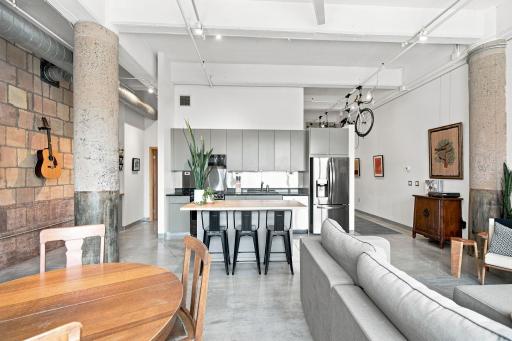 Views of the fully updated kitchen and hanging bicycle storage.
